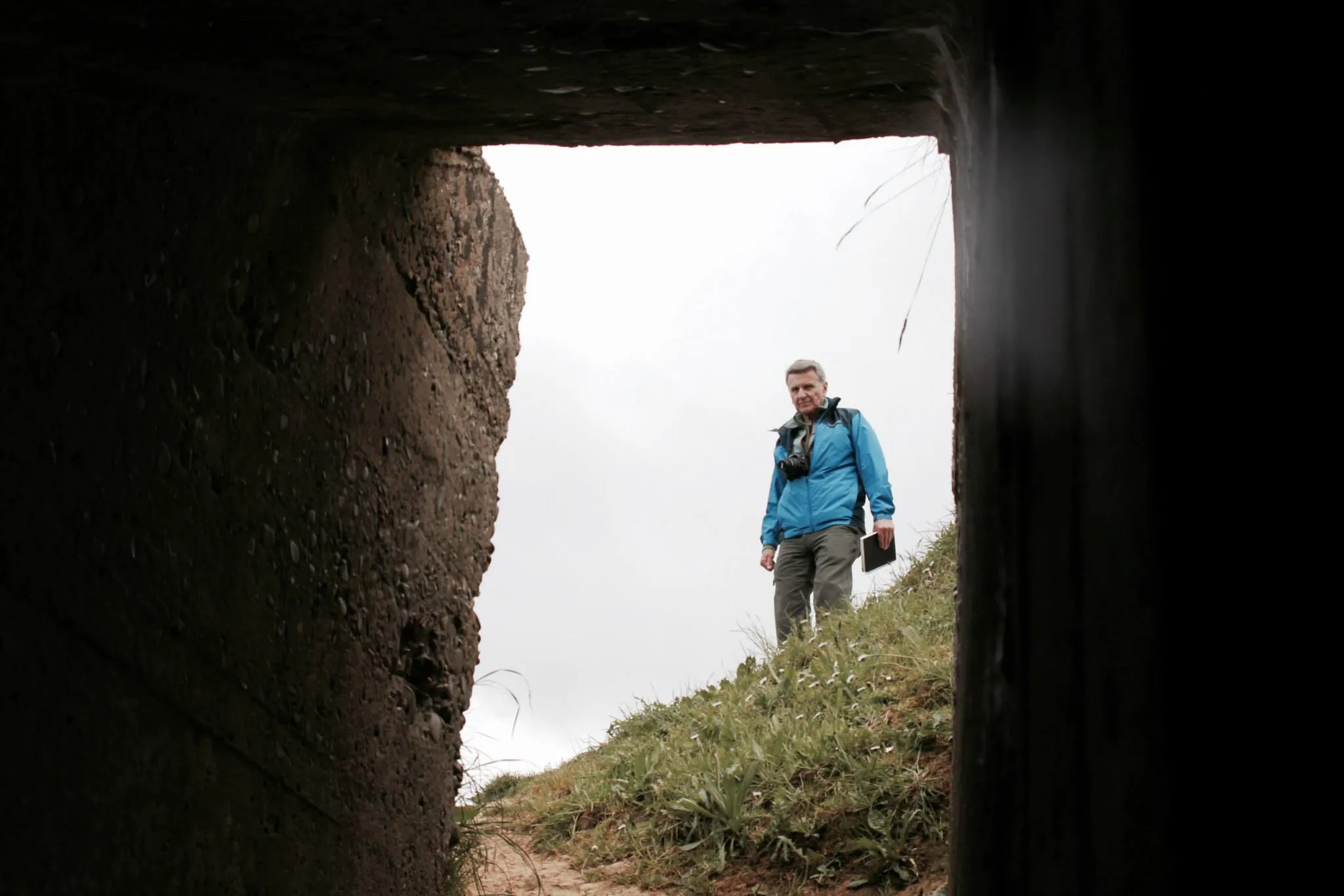 My grandfather 'Papa' looking into a bunker at Omaha Beach, Normandy.