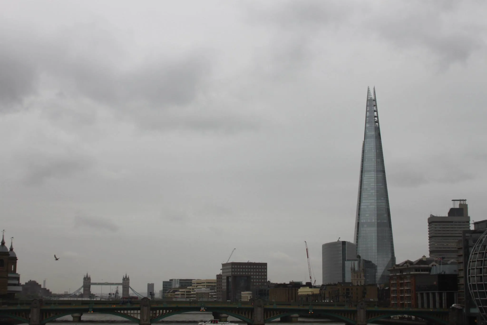 'The Shard' in landscape with Tower Bridge in the distance.